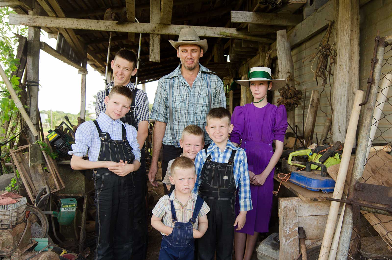 Mennonite man and his children, Orange Walk, Belize